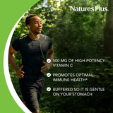 NaturesPlus Orange Juice Vitamin C Chewable Tablets with a measuring spoon