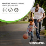 NaturesPlus Ultra Cranberry chewable tablets on a table with fruits