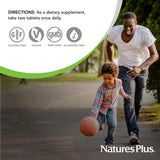 NaturesPlus Ultra Cranberry chewable tablets on a wooden table