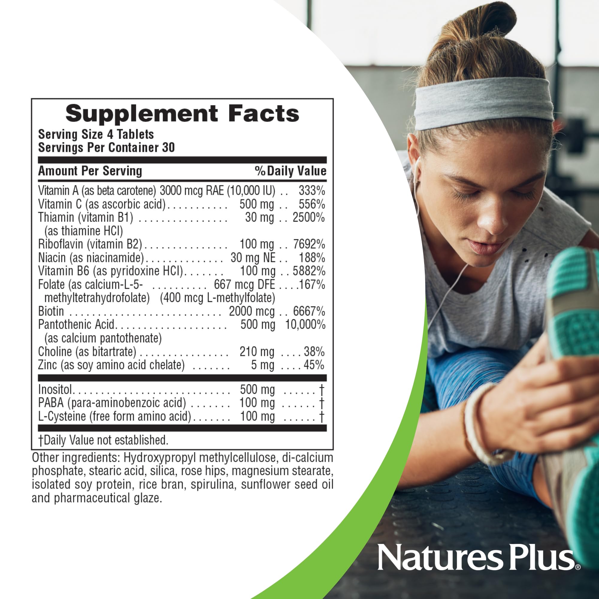 NaturesPlus Ultra Hair supplement packaging on a wooden table