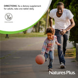 NaturesPlus Ultra II Multivitamin 90 Tablets with a glass of water