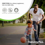 NaturesPlus Vitamin A 10,000 IU bottle on a wooden table