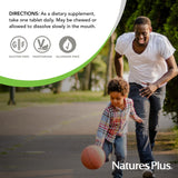 NaturesPlus Vitamin E Chewable tablet in a hand