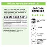 NatureWise Garcinia Cambogia Extract Capsules on a wooden table