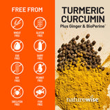 NatureWise Turmeric Curcumin Capsules 500mg on a wooden table