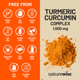 NatureWise Turmeric Curcumin capsules on a wooden table