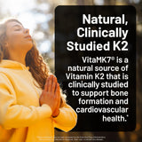 NatureWise Vegan Vitamin D3 + K2 Softgels with a measuring spoon