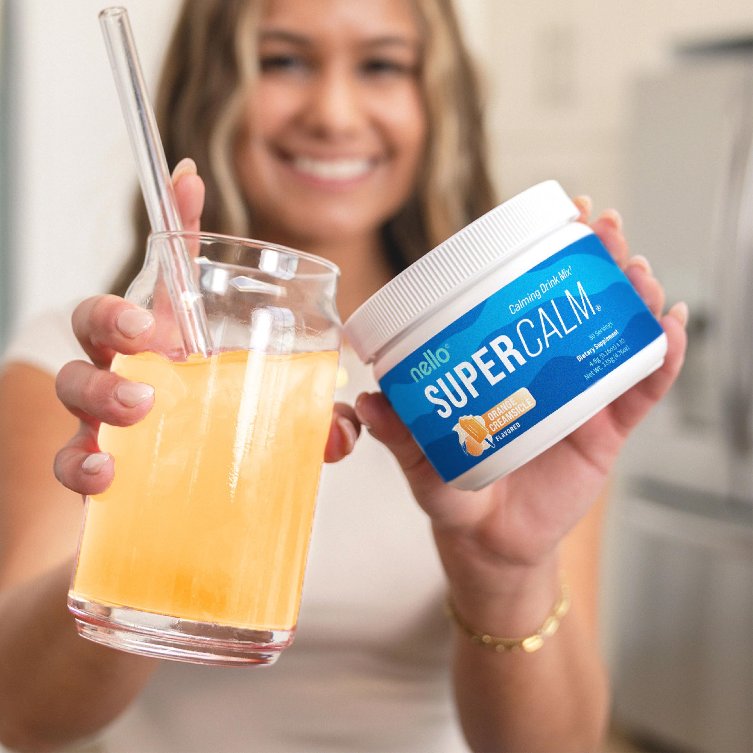 Nello Supercalm Adaptogenic Powder Drink Mix in a glass