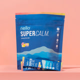 Nello Supercalm Adaptogenic Powder Drink Mix in a glass