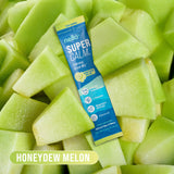 Nello SuperCalm Adaptogenic Powder Drink Mix served with honeydew melon slices