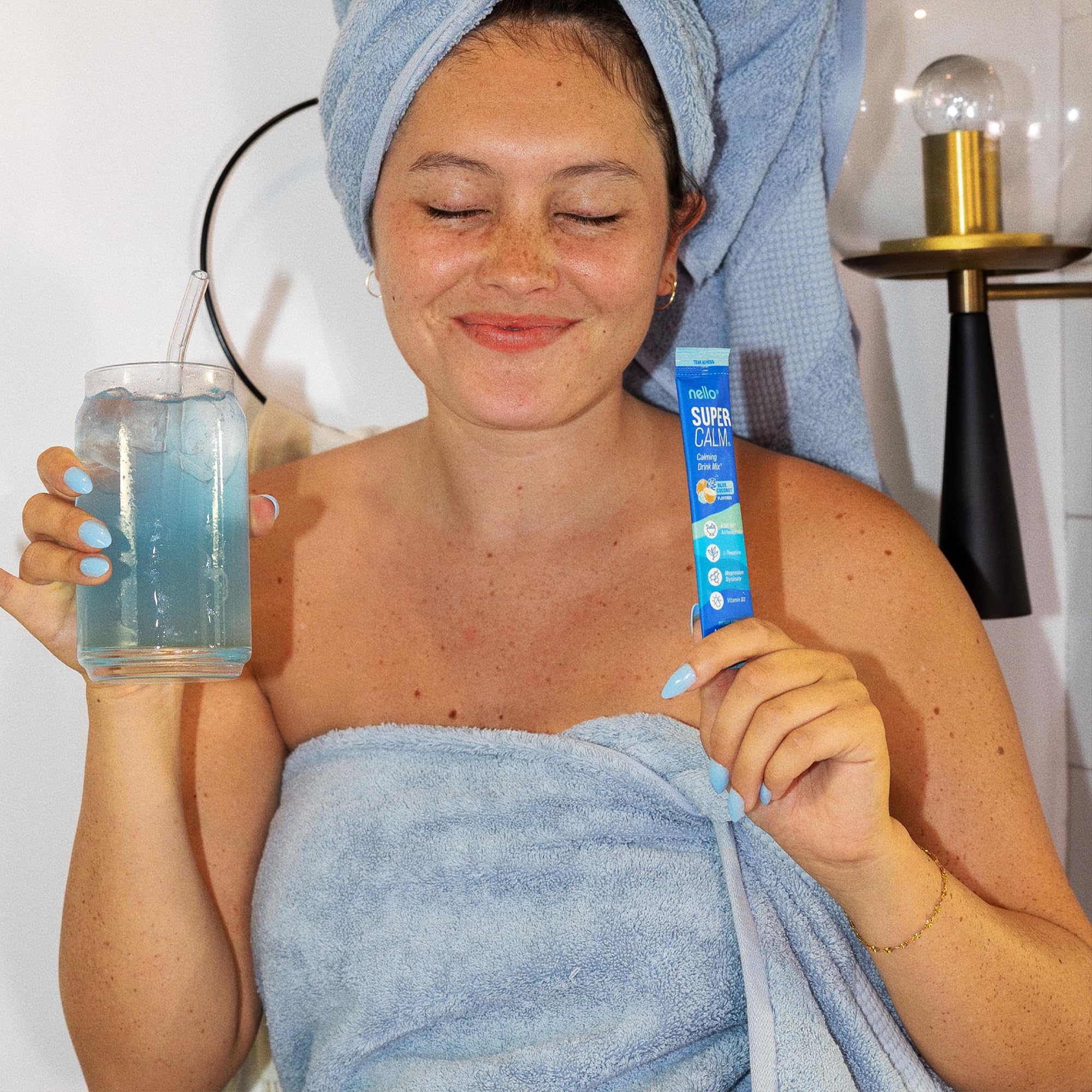 Nello SuperCalm Blue Coconut Powder Drink Mix packets in a lifestyle setting