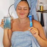 Nello SuperCalm Blue Coconut Powder Drink Mix packets in a lifestyle setting