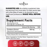 NEW AGE Cranberry Liquid Drops with a glass of water