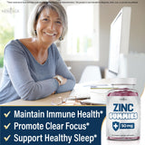 NEW AGE Zinc Gummies 215g lifestyle scene with a glass of water