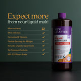 New Chapter Complete Multivitamin Liquid with fresh fruits on a kitchen counter
