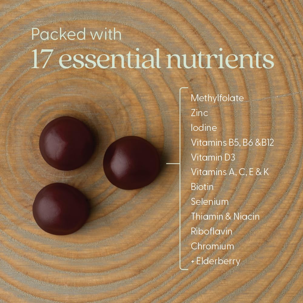 New Chapter Women's Gummy Multivitamins on a wooden table with fresh berries