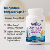 Nordic Naturals Complete Omega Jr. capsules on a wooden surface