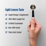 Nordic Naturals Omega-3 Liquid Fish Oil pouring into a spoon