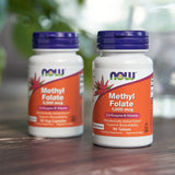 NOW Foods B9 (Folic Acid) 50 Veg Capsules on a wooden table