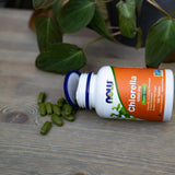 NOW Foods Chlorella Tablets 3000mg with a measuring spoon