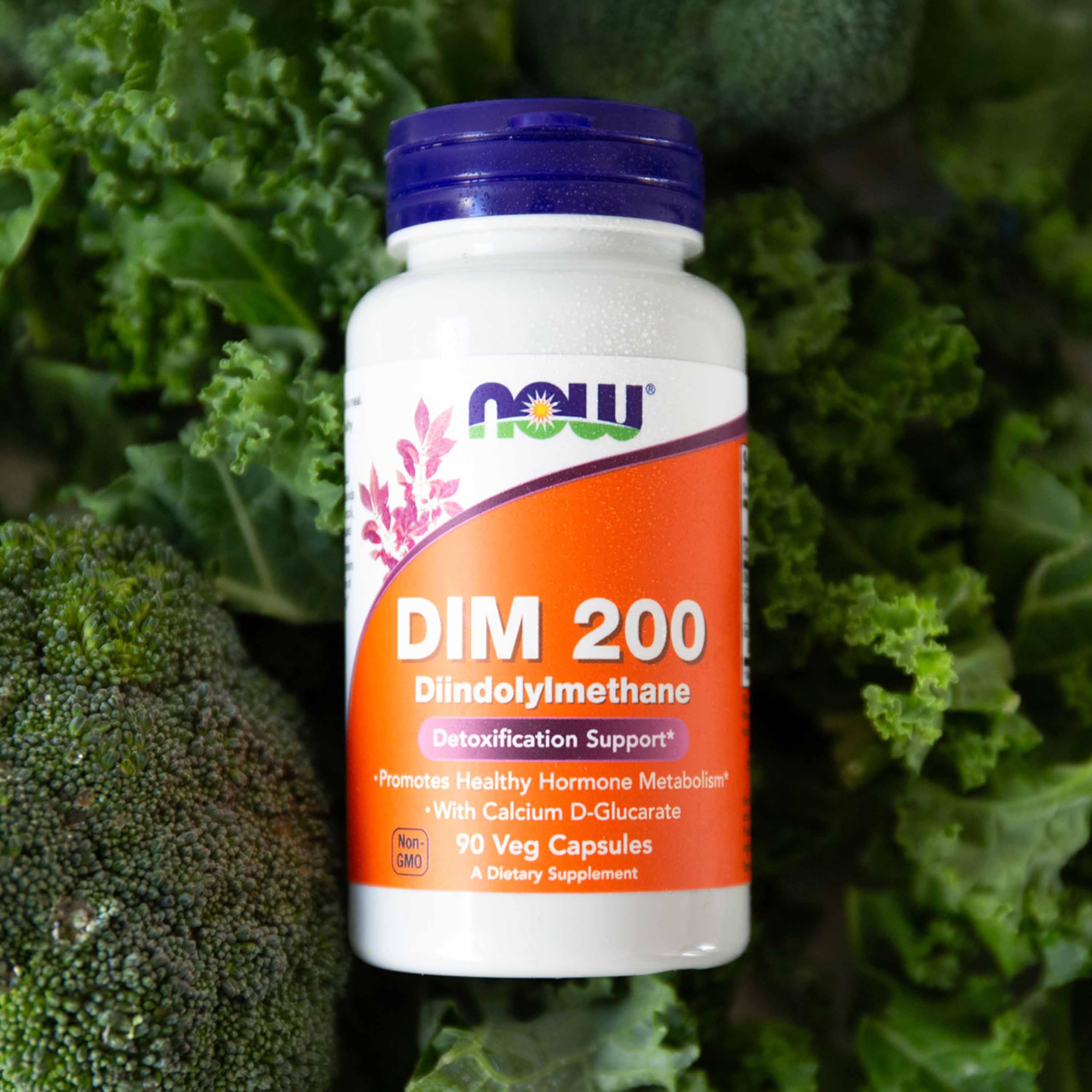 NOW Foods DIM 200 Capsules with a glass of water