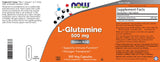 NOW Foods L-Glutamine 500 mg capsules in a hand