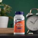 NOW Foods Sleep Regimen 3-in-1 Supplement with a glass of water