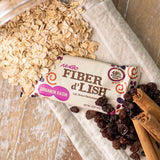 NuGo Fiber d'Lish Soft-Baked Fiber Bar on a wooden table