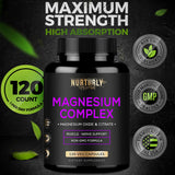 NURTURLY Magnesium capsules on a wooden table