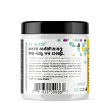 Nuton Happy Dreams capsules with a glass of water