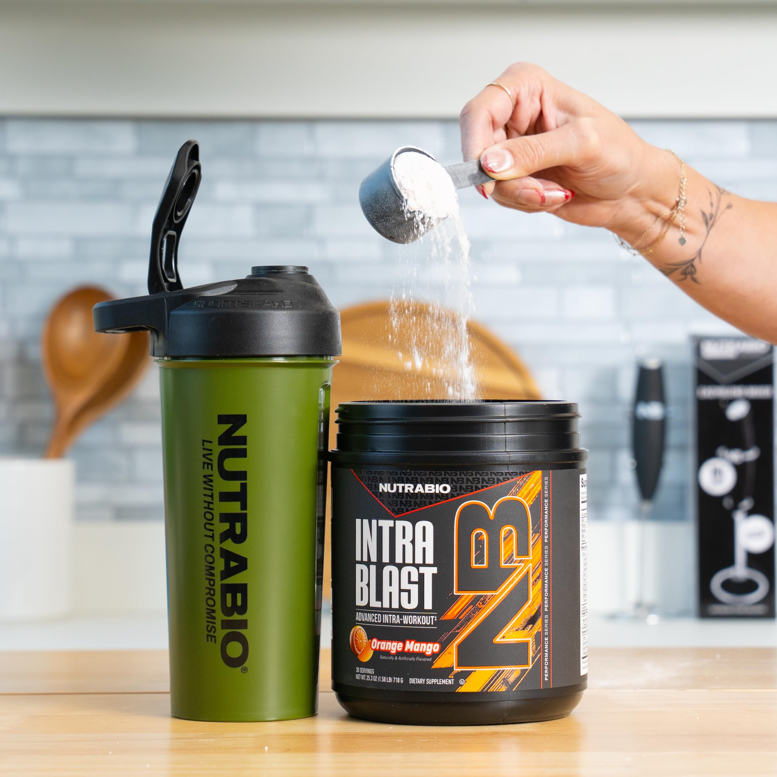 NutraBio Intra Blast BCAA Powder 718g in a shaker
