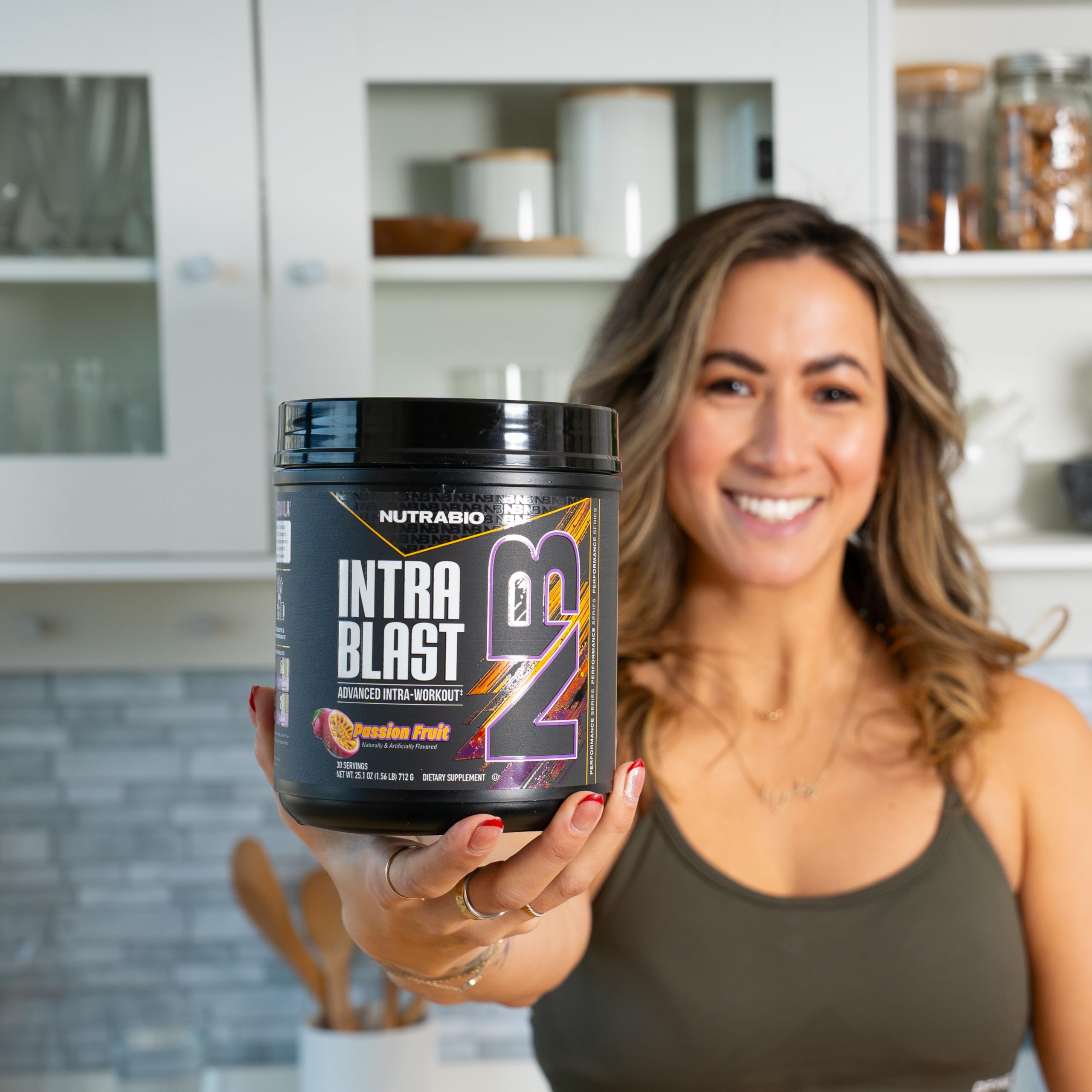 NutraBio Intra Blast BCAA Powder 726g scoop next to powder
