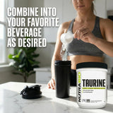 NutraBio Taurine Powder 500g on a wooden table