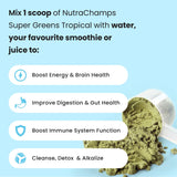 NutraChamps Super Greens Powder in a glass of water