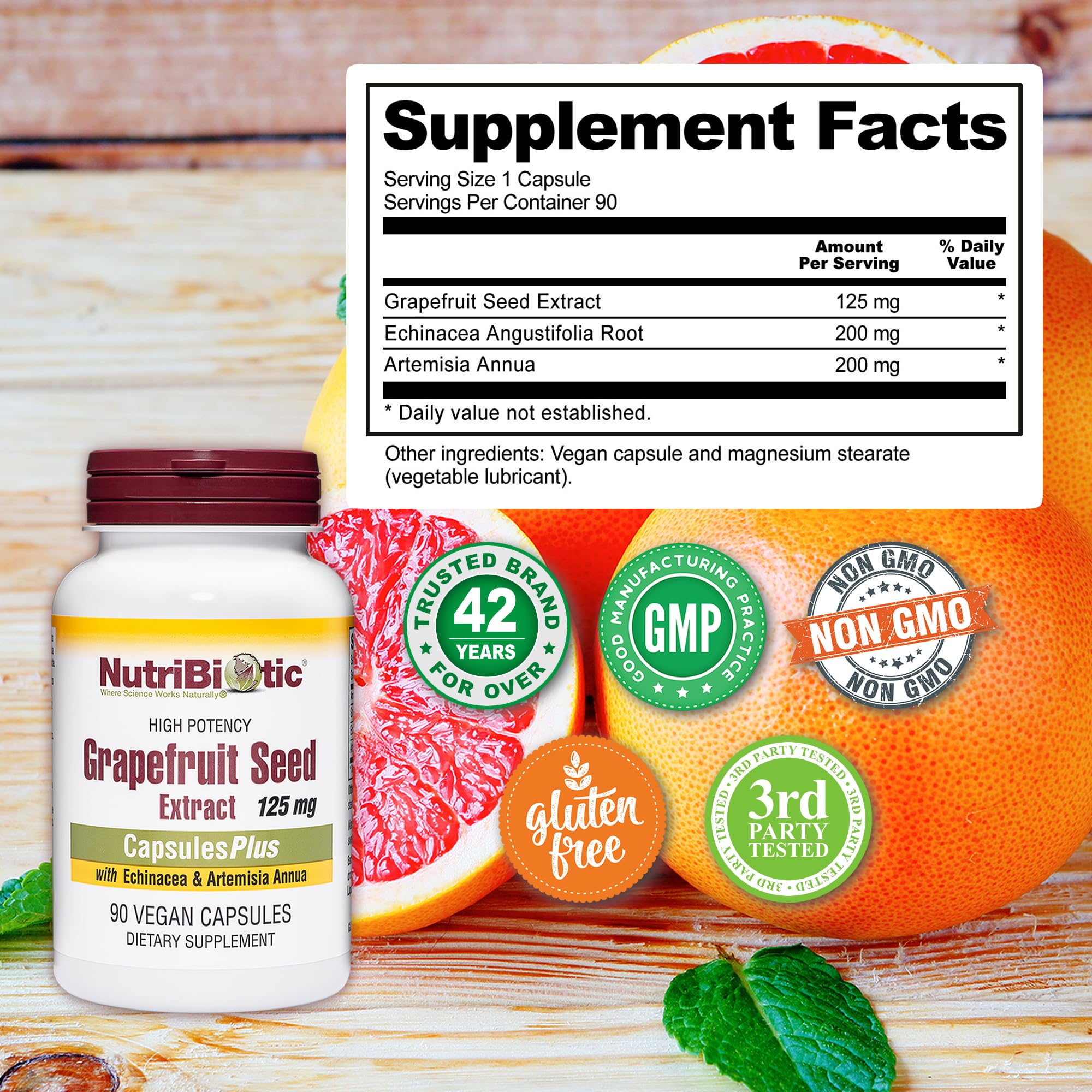 NutriBiotic Grapefruit Seed Extract 125mg capsules on a wooden table