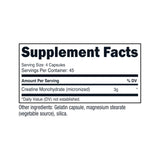 Nutricost Creatine Monohydrate capsules on a wooden table