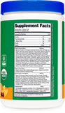 Nutricost Organic Greens Powder 408g in a glass of water with fresh oranges