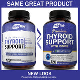 NutriFlair Thyroid Support Supplement capsules on a wooden table