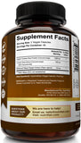 NutriFlair Turmeric Curcumin capsules in a hand