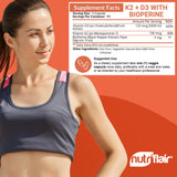 NutriFlair Vitamin D3 + K2 capsules on a wooden table