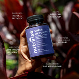 NutriRise daily wellness Support Supplement capsules in a glass of water