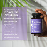 NutriRise daily wellness Support Supplement capsules on a wooden table
