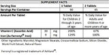 NutritiPure Iron Supplement Tablets Tangerine Tango in a child's hand