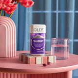 OLLIE Ultra Strength Sleep Softgels in a hand for size comparison