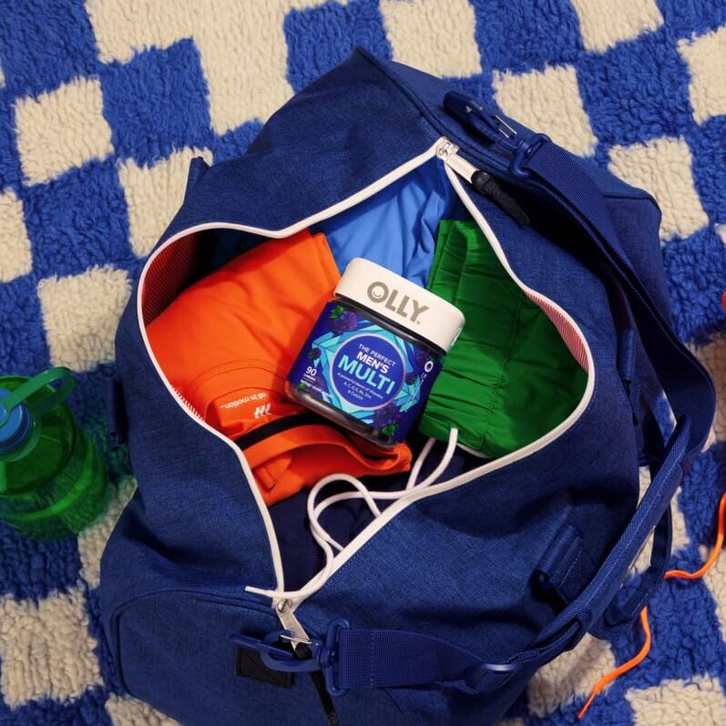 OLLY Men's Multi Gummies with a hand holding a gummy