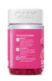 OLLY Undeniable Beauty Gummies on a wooden table with fresh grapefruit
