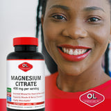 Olympian Labs Magnesium Citrate bottle with a hand holding it
