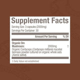 OM MUSHROOM SUPERFOOD Cordyceps Mushroom Capsules on a wooden table