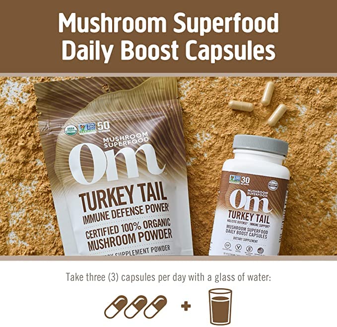 OM MUSHROOM SUPERFOOD Turkey Tail Mushroom Capsules with a glass of water