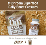 OM MUSHROOM SUPERFOOD Turkey Tail Mushroom Capsules with a glass of water